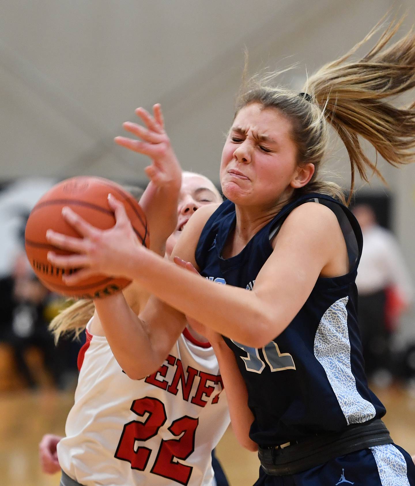 Nazareth's Stella Sakalas grabs a rebound in front of Benet's Bridget Rifenburg (22) during a game on Dec. 13, 2023 at Benet Academy in Lisle.