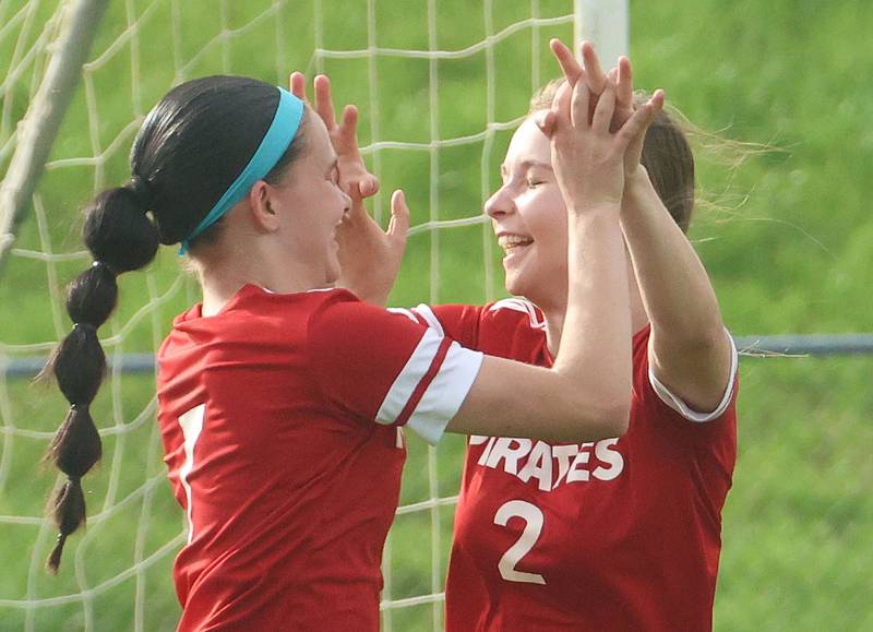 Ottawa's Georgia Kirkpatrick hi-fives teammate Chloe Carmona after scoring a goal against L-P on Monday, April 13, 2026 on King Field at Ottawa High School.