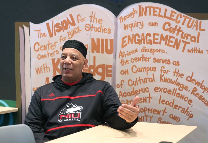 Derrick Smith, an academic counselor in the Center for Black Studies at Northern Illinois University and father of four, talks Tuesday, June 13, 2023, at the center, about what fatherhood has meant to him, how his own father helped change his life and how he feels like a father to the many students he mentors on campus at NIU.