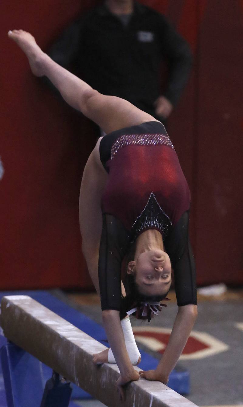 Prairie Ridge's Tess Morton competes in the preliminary round of the balance beam on Friday, Feb. 21, 2025, during the IHSA Girls State Final Gymnastics Meet at Palatine High School.