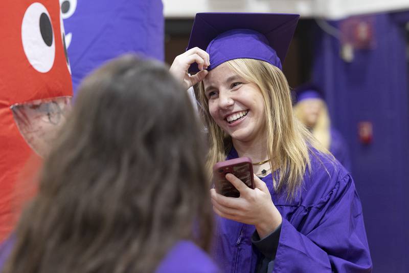 Dixon senior Skylar Smith smiles while visiting with moms Wednesday, May 21, 2025, at Reagan Middle School.