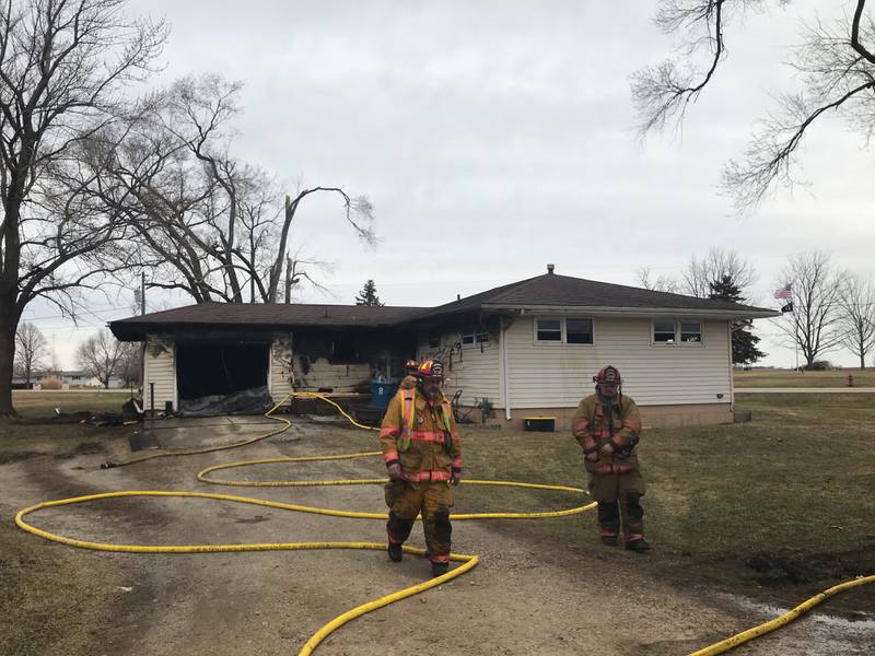 Firefighters on scene at 607 E. Lincoln St. in Cherry where a midday fire broke out in the one-story home on Sunday, March 14.