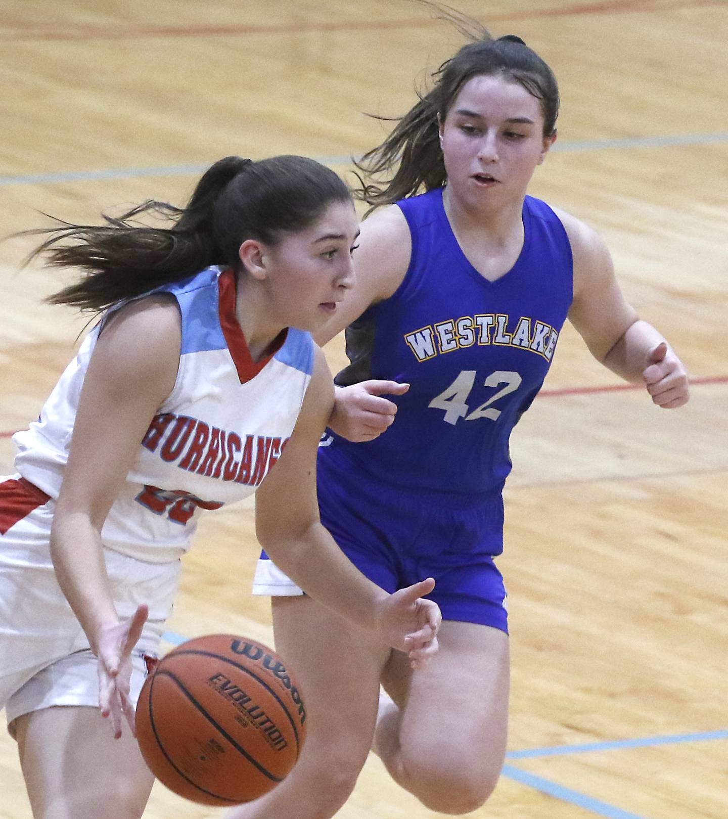 Marian Central's Ella Notaro pushes the ball up the court against Westlake Christian’s Eva Muniz during a non-conference girls basketball game Monday, Feb. 6, 2023, at Marian Central High School  in Woodstock.