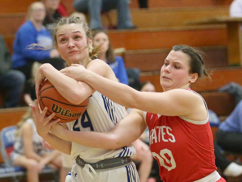 Princeton's Keighley Davis grabs a rebound over Ottawa's Kendall Lowery on Monday, Feb. 5, 2024 in Prouty Gym.