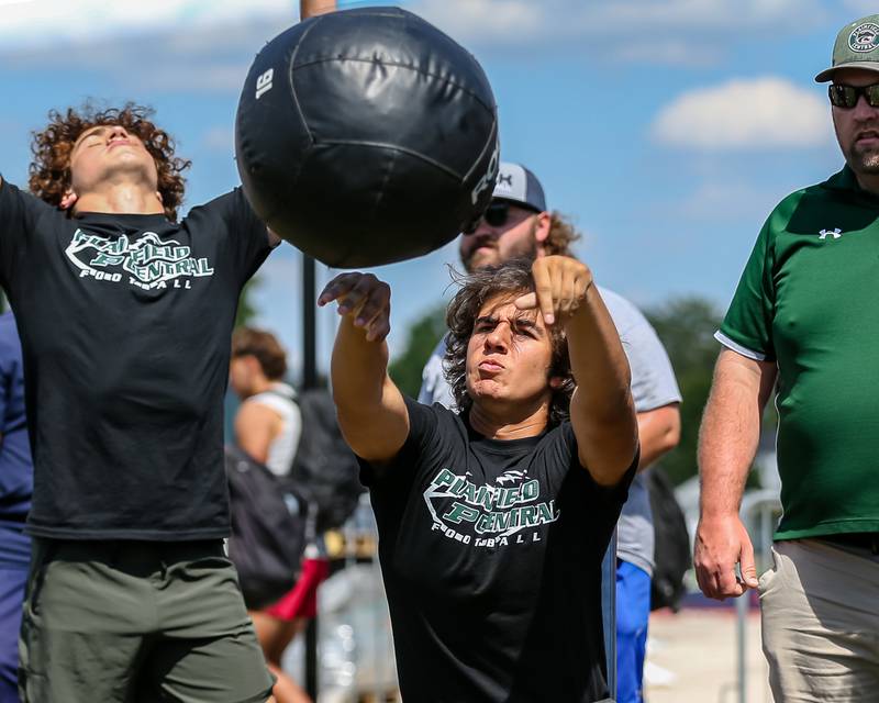 Plainfield Central competes in the weighted ball toss at the West Aurora High School Battle of the Big Butts Linemen Challenge.  July 14, 2022.
