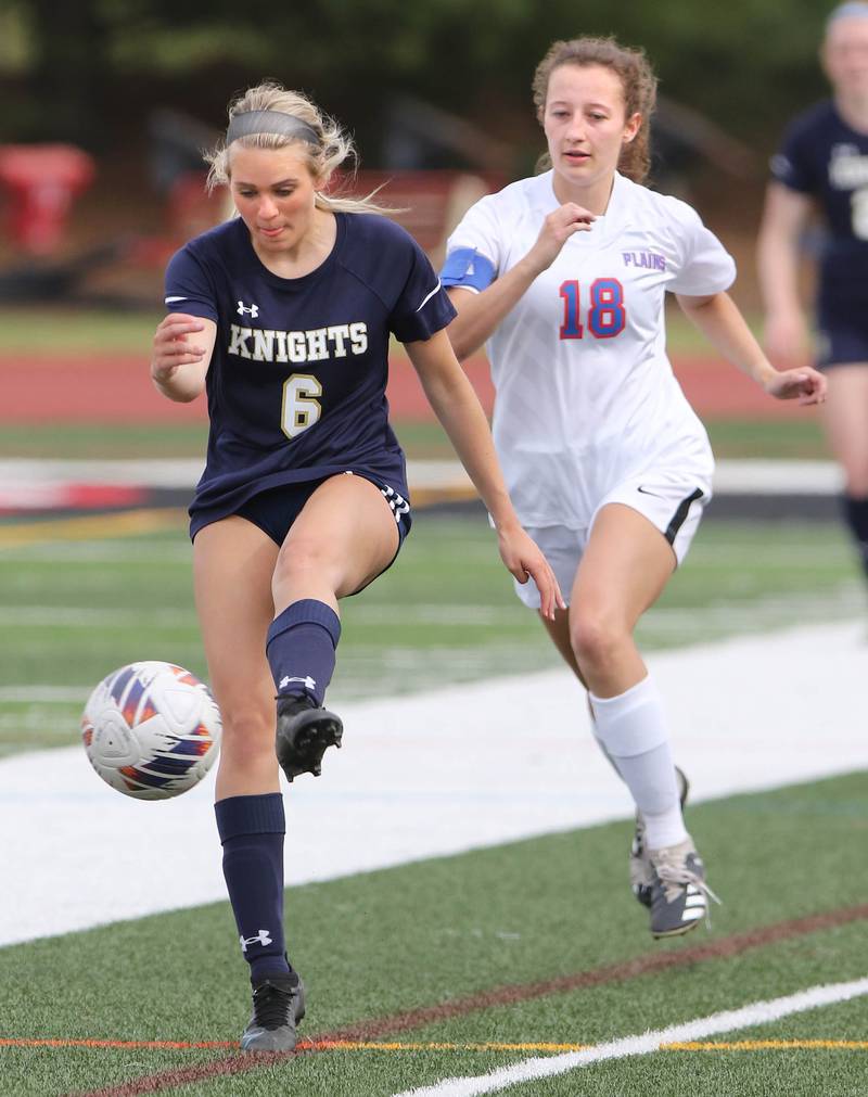IC Catholic Prep's Matea O'Donnell kicks the ball away from Pleasant Plains' Brookelyn Hermes during the IHSA Class 1A state girls soccer third place game Saturday, May 27, 2023, at North Central College in Naperville.