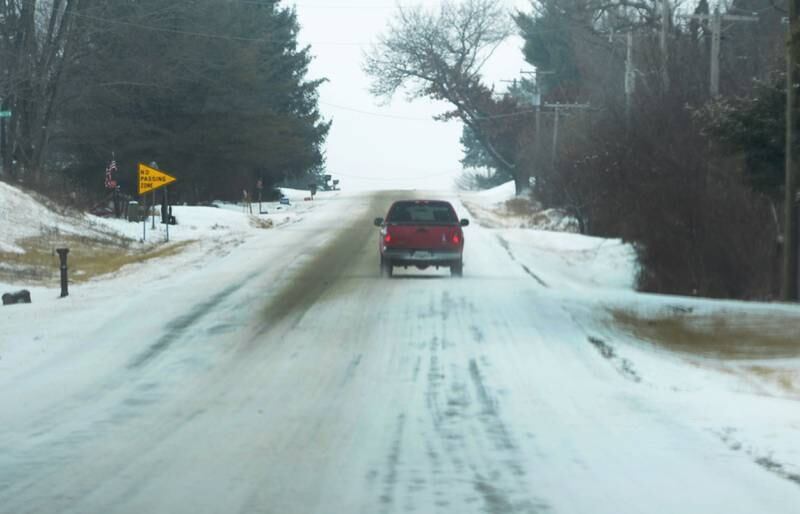 Secondary roads were snowpacked and icy Wednesday, Feb. 12, 2025 after several inches of snow fell across the region. Road crews began plowing and salting early in the day in an attempt to keep the roads drivable.
