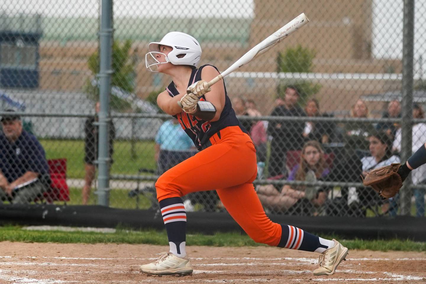 Oswego’s Kennedy Gengler (9) singles against Neuqua Valley during a Class 4A Oswego East Regional Final softball game at Oswego East High School on Friday, May 30, 2025.