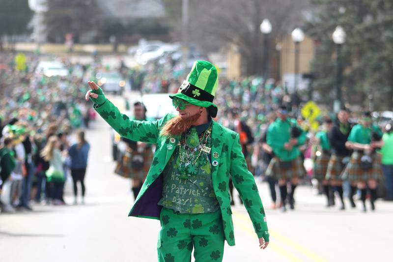 A man dressed as a leprechaun marches during the ShamROCKS the Fox Parade along Green Street in McHenry on Saturday, March 15, 2025.