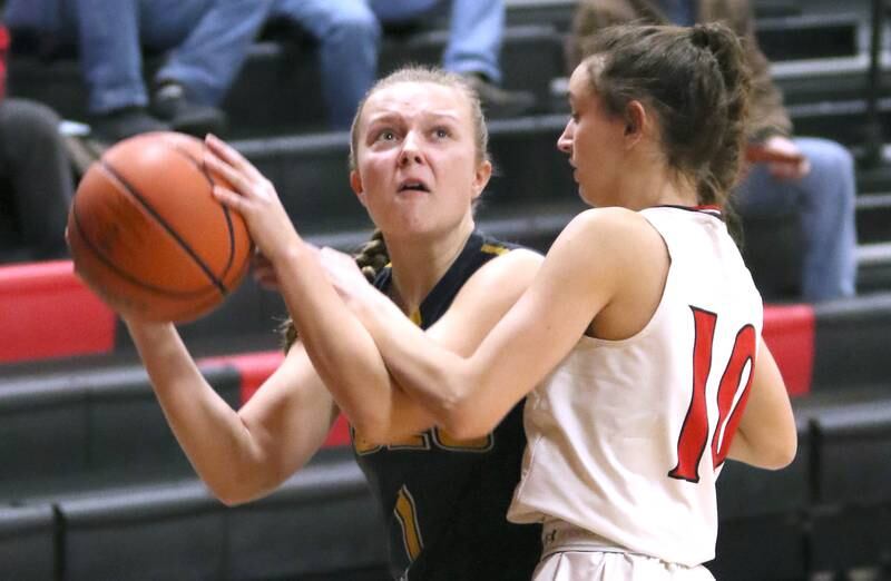 Polo's Kadence Sheaffer is fouled by Indian Creek's Isabella Turner during their Class 1A regional game Tuesday, Feb. 15, 2022, at Indian Creek High School in Shabbona.