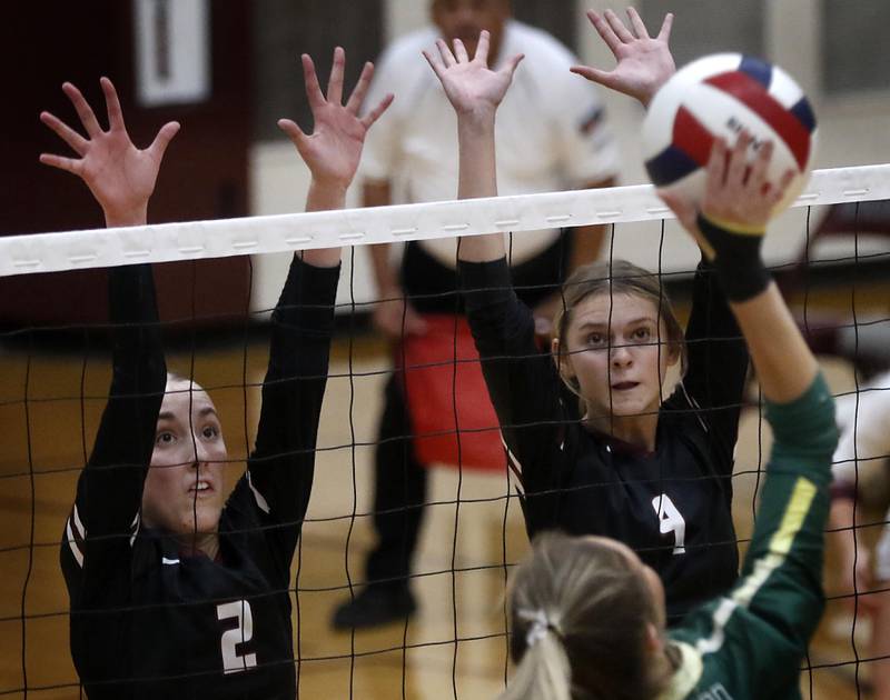 Prairie Ridge's Addison Smith and Prairie Ridge's Hailey Muench try to block the ball during the IHSA Class 3A Prairie Ridge Regional championship volleyball match against Crystal Lake South on Thursday, Oct. 30, 2025, at the Prairie Ridge High School in Crystal Lake.