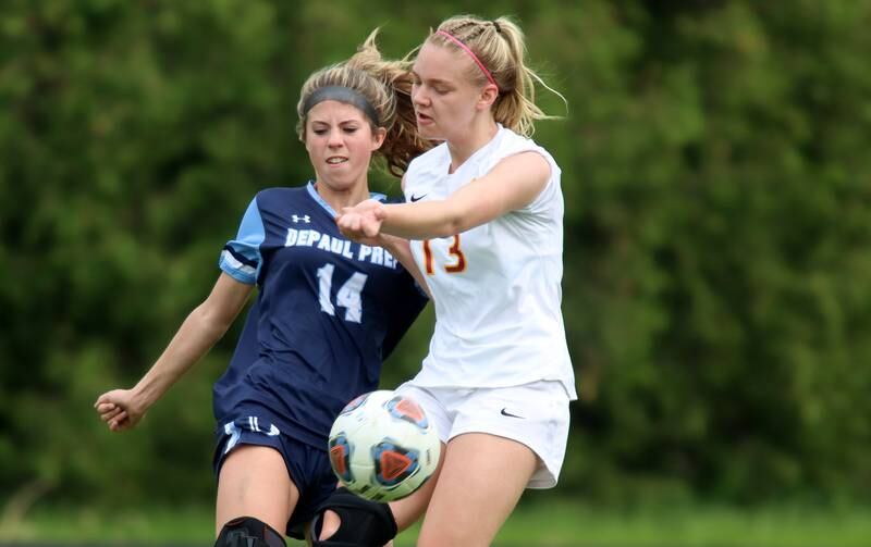 Richmond-Burton’s Jordan Otto, right, battles DePaul Prep’s Taylor Tabellione during sectional title game action at Marian Central in Woodstock Friday evening.