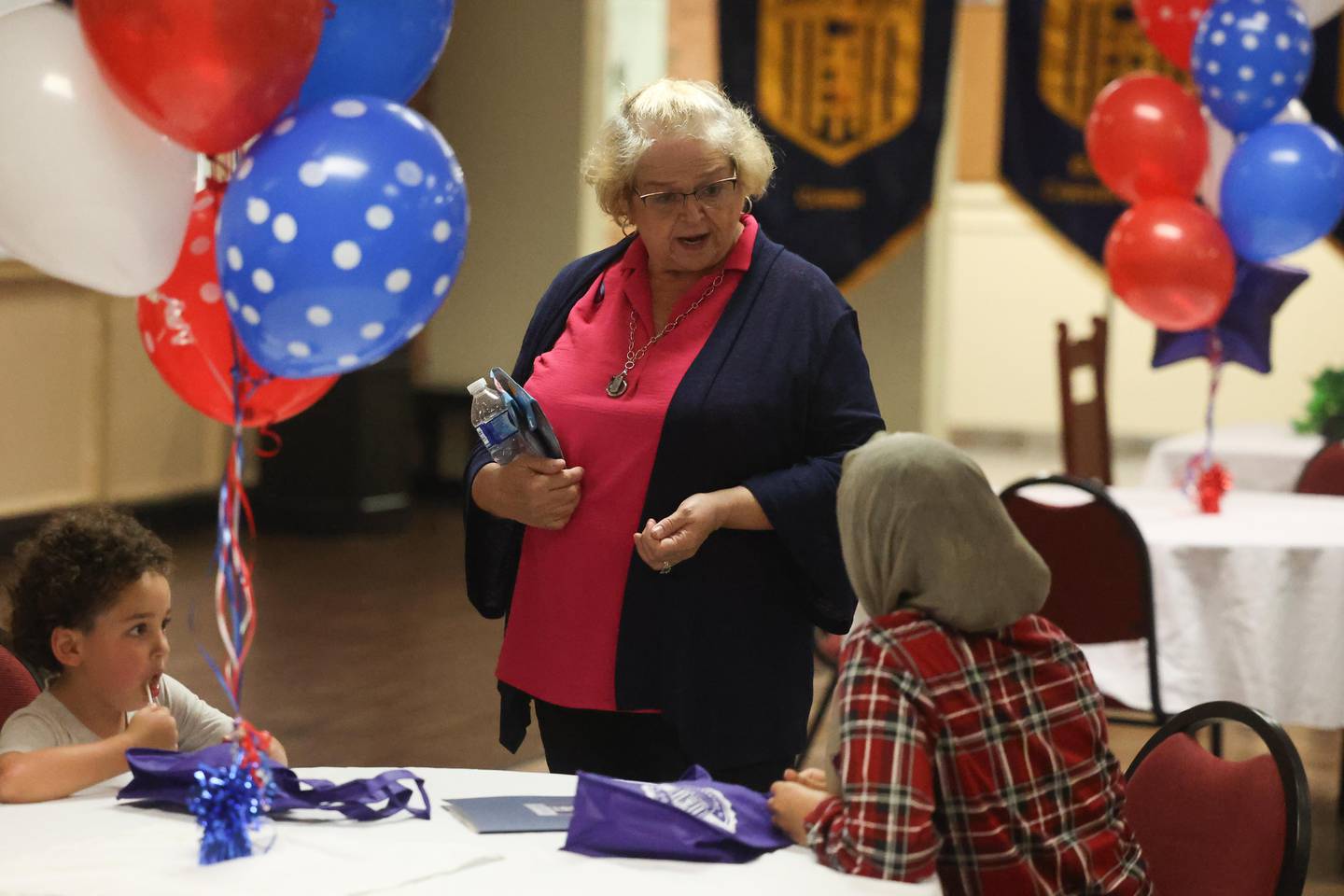 Sue Whitehead, Office Coordinator, speaks with a potential student at the Job Corps 60th anniversary open house on Thursday, August 29, 2024 in Joliet.