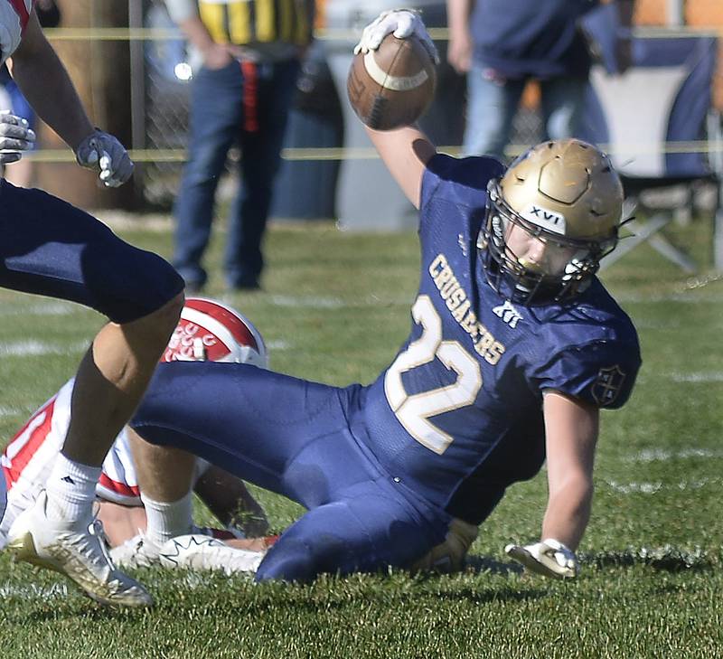 Marquette’s Jurnee Reed is brought down on a run in the 1st quarter Saturday at Marquette. during the Class 1A first round playoff game on Saturday, Oct. 29, 2022 at Gould Stadium in Ottawa.