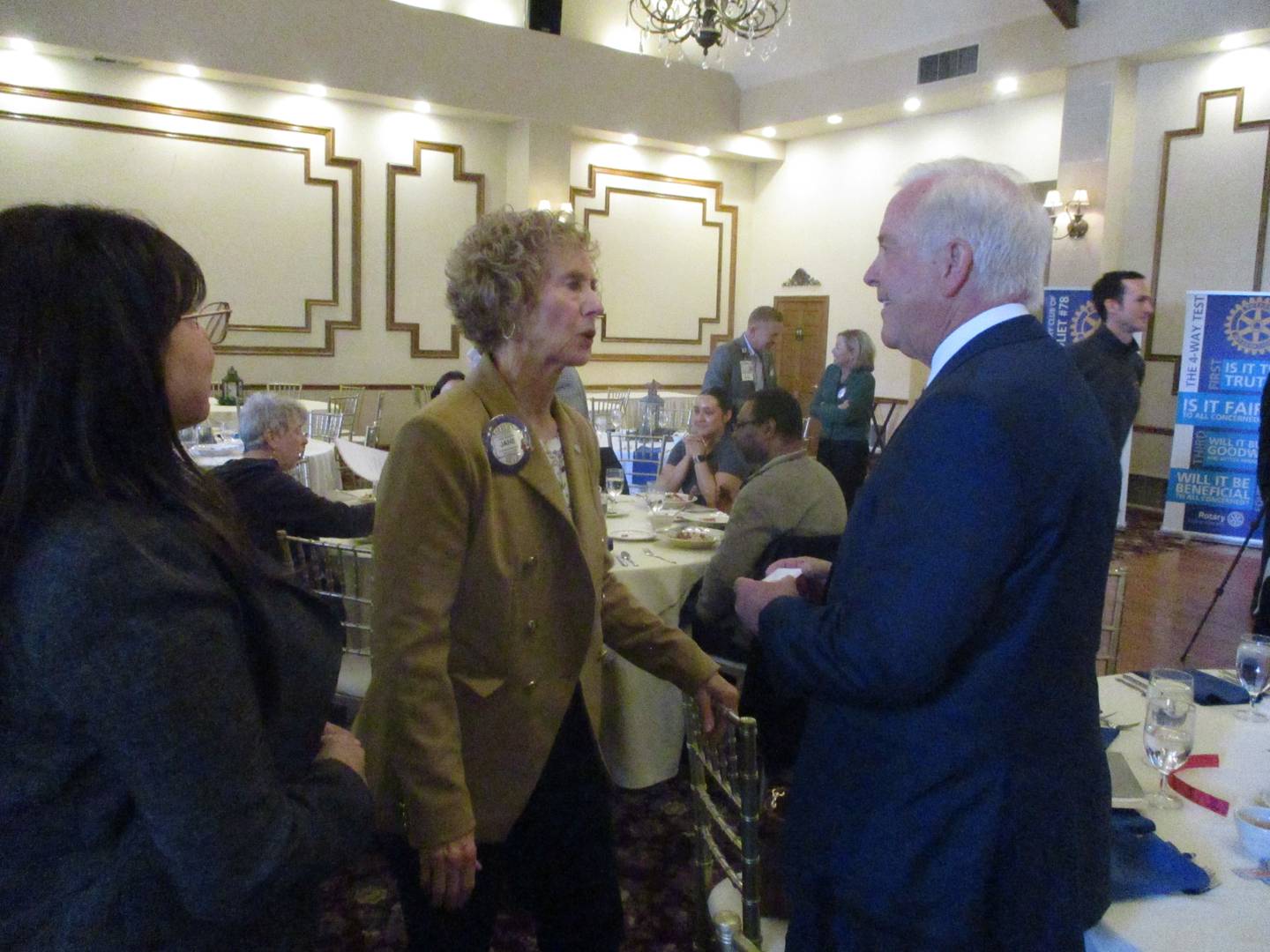 Jane Condon (center) speaks with Joliet Mayor Terry D'Arcy after his speech to the Rotarian Club of Joliet on Tuesday. March 11, 2025