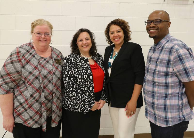 Joliet School District 86 Superintendent Dr. Theresa Rouse (third from left) and Board of School Inspectors President Elvis Madison, Jr. (far right) congratulate (left to right) Dr. Judith Nash and Marysol Sandoval on their new positions with the District 86 administration.