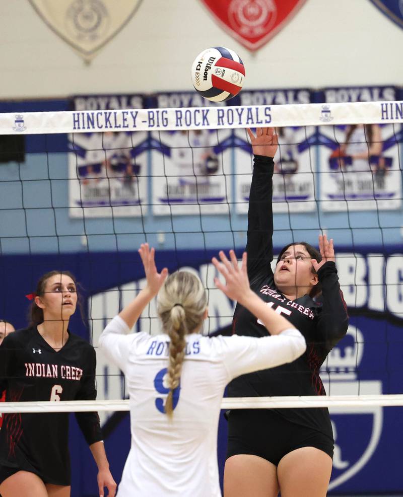Indian Creek's Paloma Cardenas tries to tip the ball over Hinckley-Big Rock's Julianne Miceli during their match Tuesday, Sept. 24, 2024, at Hinckley-Big Rock High School.