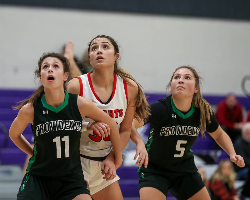 Providence's Bella Morey (11) blocks out Lincoln Way Central's Angelina Panos (30) at the free throw line in the WJOL Tournament Championship game. Nov 18, 2023.