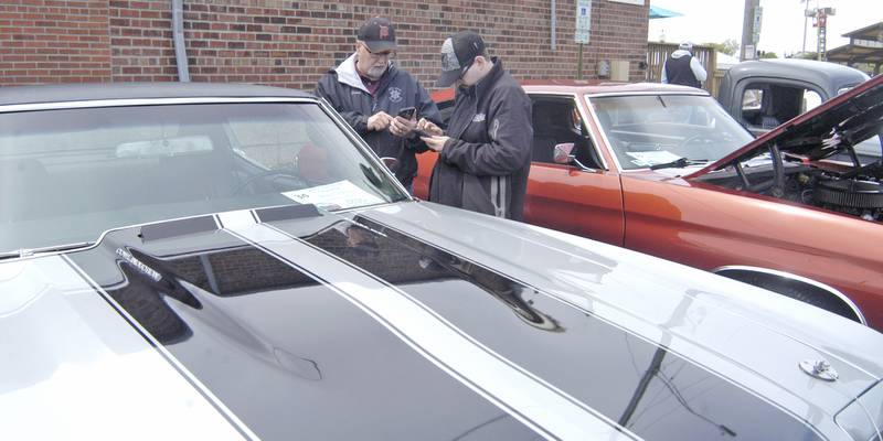 Lou and Miles Quick of Sterling take down some notes on a 1970 Chevelle. Sterling Main Street's 12th Annual Car Show took place at the Sterling Marketplace on Sunday, May 4th, 2025.