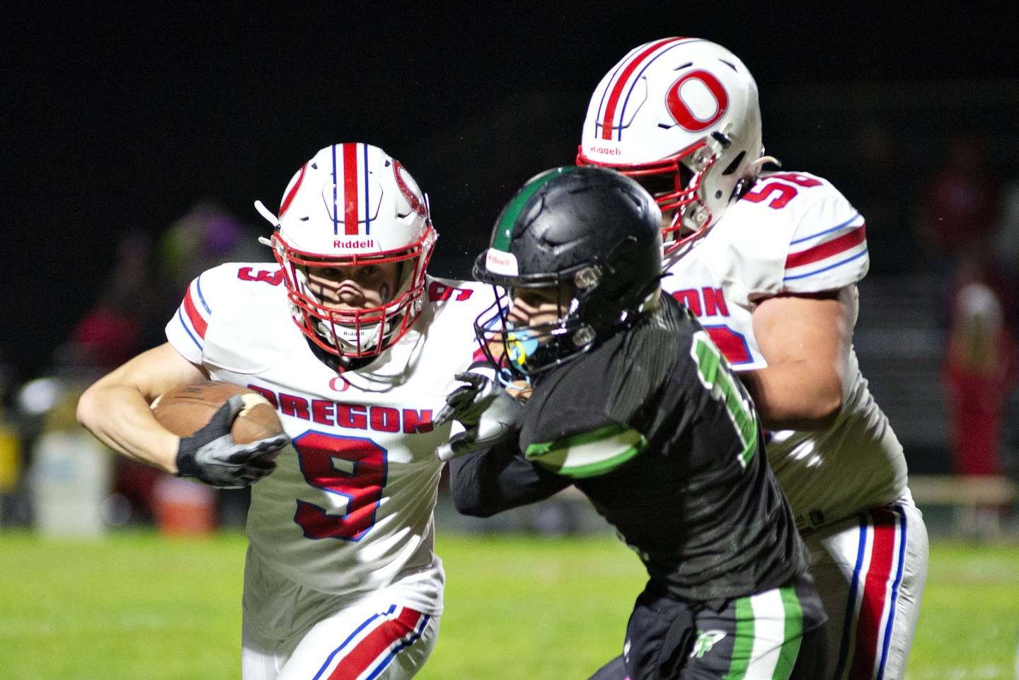 Oregon’s Noah Reber picks up yards against Rock Falls Friday, Oct. 14, 2022.