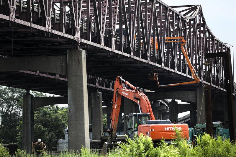 Traffic flows along the Interstate 80 bridge on Wednesday, July 26, 2017, as bridge crews inspect the structure over the Des Plaines River in Joliet, Ill.