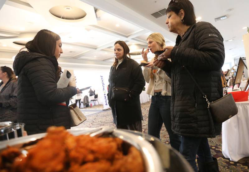 (From left) Analiyah Flores, Emily VanDuzer, Mallorey VanDuzer and Revenna Flores mingle while trying food from Bernardi's catering the Shaw Local Radio Bridal and Event Expo on Sunday, Feb. 23, 2025 at Senica's Oak Ridge in La Salle.