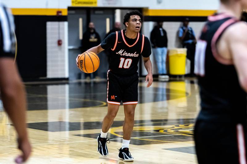 Minooka's Luke Page sets up a play during a varsity boys basketball game against Joliet West at Joliet West on Jan. 6, 2026.