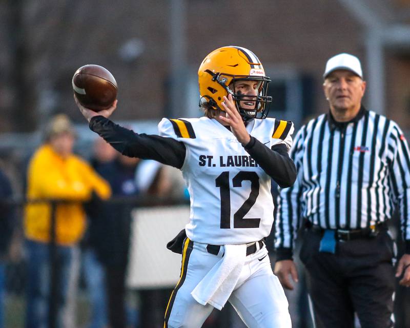 St Laurence's Evan Les (12) passes during Class 4A third round playoff football game between St Laurence at IC Catholic Prep.  Nov 11, 2023.