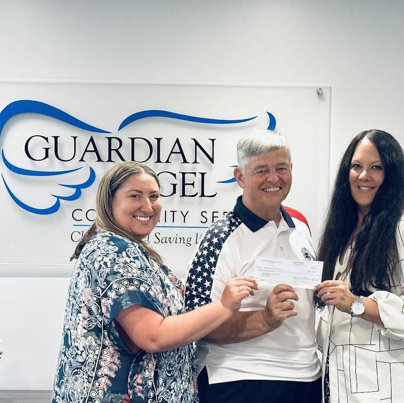 James Ruzon (center), member of the Guardian Angel Community Services' board of directors and Joliet Exchangite, presents a $20,000 check to Guardian Angel Chief Executive Officer Ines Kutlesa (right) and Guardian Angel Exchange Club Center Program Manager AnnMarie Coglianese (left).