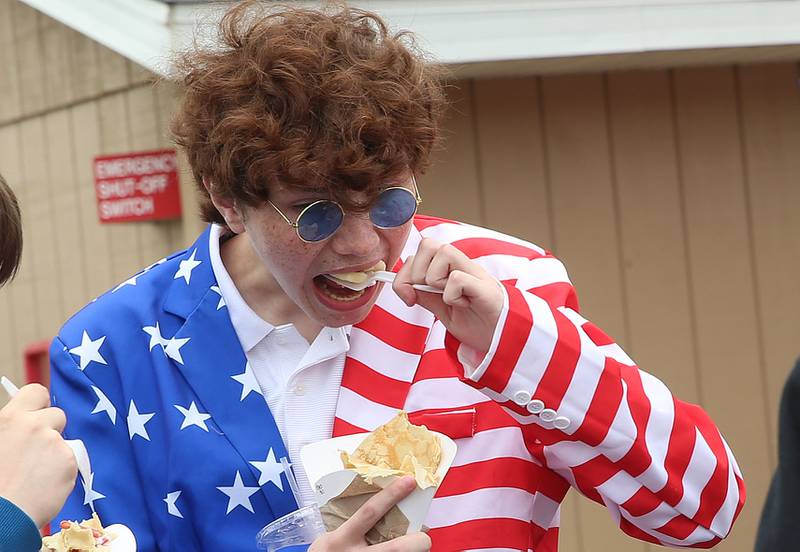 Putnam County High School student TJ Goulding tries crapes during the first annual Homecoming Parking Lot Party and Food Truck Festival on Monday, Sept. 23, 2024 at Putnam County High School. The Putnam County High School Student Council and the Work-Based Learning Program came up with the idea.