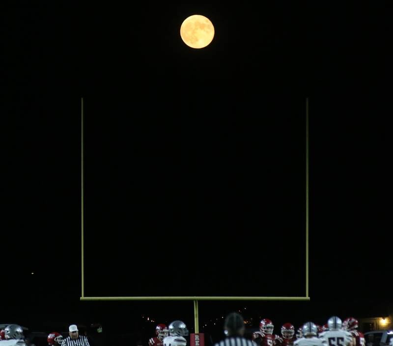 A nearly full moon rises above the goalpost on Friday, Sept. 29, 2023 at Richard Nesti Stadium.