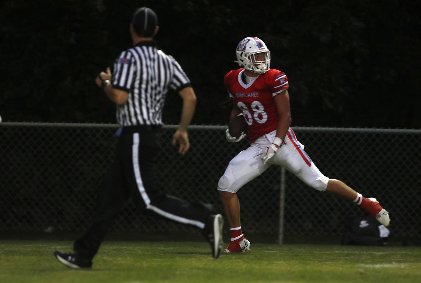 Marian Central's Christian Bentancur looks back as he runs for a touchdown during a nonconference football game against Marian Central Friday, Aug. 25, 2023, at Marian Central Catholic High School.