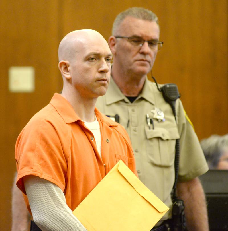 Matthew T. Plote is escorted into an Ogle County courtroom for a hearing on Thursday, May 4, 2023.