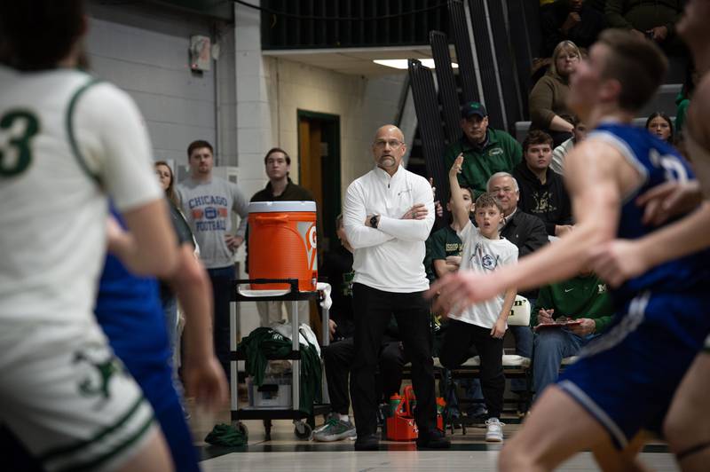 Bishop McNamara's head coach Adrian Provost, center, watches the action on the floor against Newark on Friday, Feb. 20, 2026.