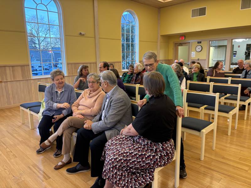 Audience members speak during FaithBridge's Thanksgiving program Nov. 23, 2025 in Crystal Lake.