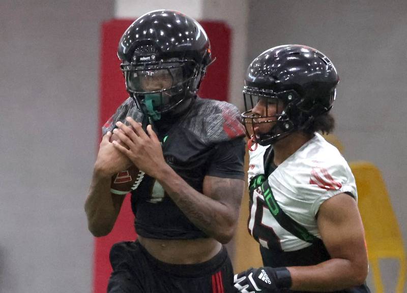 Northern Illinois’ Gary Givens carries the ball Wednesday, July 30, 2025, at the teams first practice of the season in the Chessick Practice Center at NIU in DeKalb.