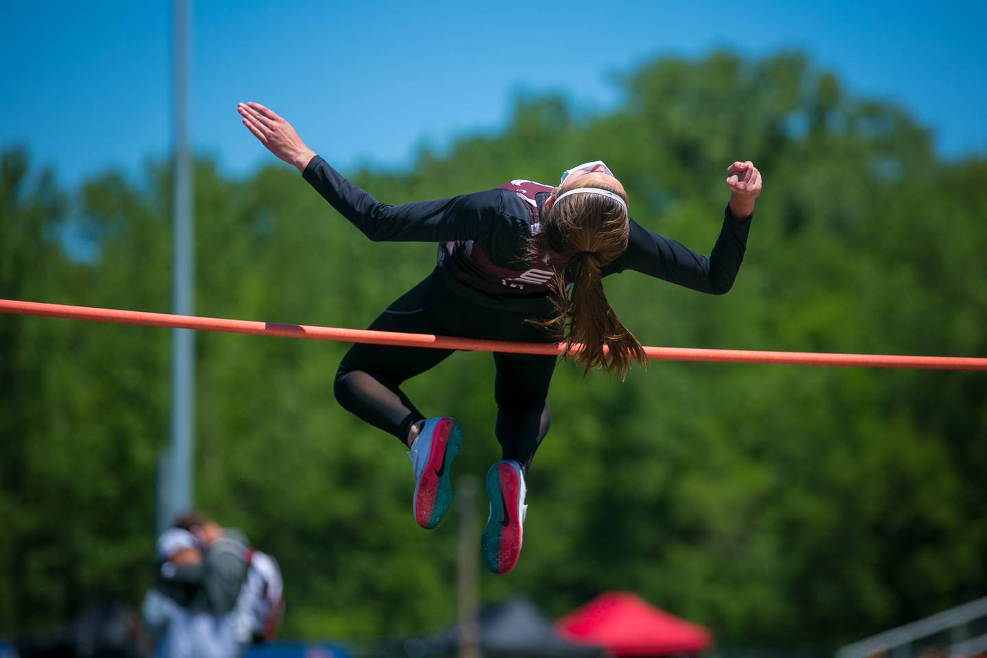 Prairie Ridge's Rylee Lydon clears the high jump bar to win the 2021 Fox Valley Conference title on May 29, 2021 in Carpentersville.