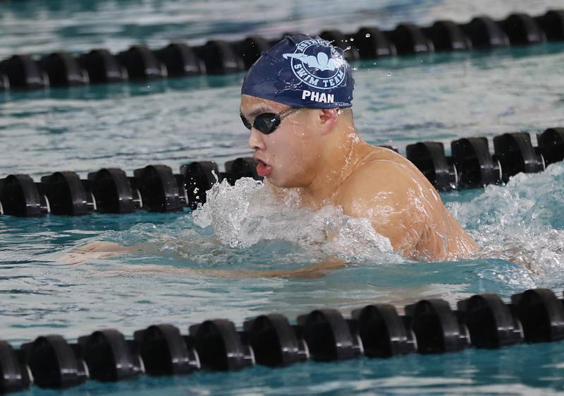 D330 Co-op’s Colin Phan swims the breaststroke as he competes in the 200 medley relay during the  Fox Valley Conference Invitational swim meet on Saturday,  Feb. 15, 2025, at Woodstock North High School.