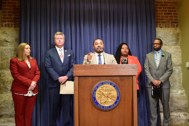 Democratic Sen. Willie Preston, center, speaks at a Statehouse news conference Wednesday, Feb. 5, 2025, about his bill to ban certain additives from foods sold in Illinois. Joining him were, from left: Sens. Rachel Ventura; Seth Lewis; Lakesia Collins; and Rep. Michael Crawford.