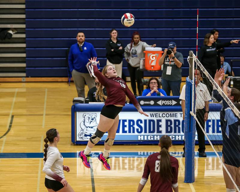Lockport's Quinn Higham (16) spikes the ball during Class 4A Riverside-Brookfield Supersectional match between Lockport at Downers Grove South.  Nov 11, 2024  in Riverside.