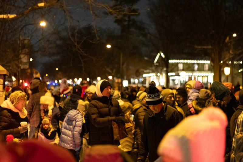 Locals fill the street in downtown Geneva for the Annual Geneva Christmas Walk on Friday, Dec. 5, 2025 in Geneva.
