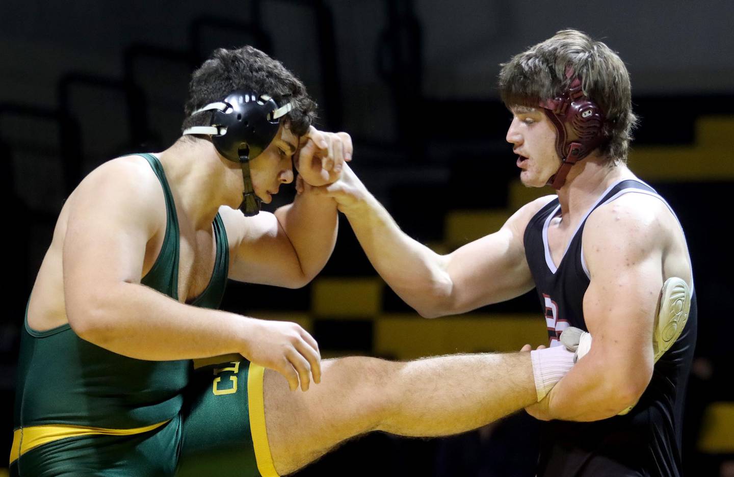 Prairie Ridge’s John Fallaw, right, battles Crystal Lake South’s Andy Burburija  in a 285-pound bout in varsity wrestling at Crystal Lake South on Thursday. Burburija won the match.