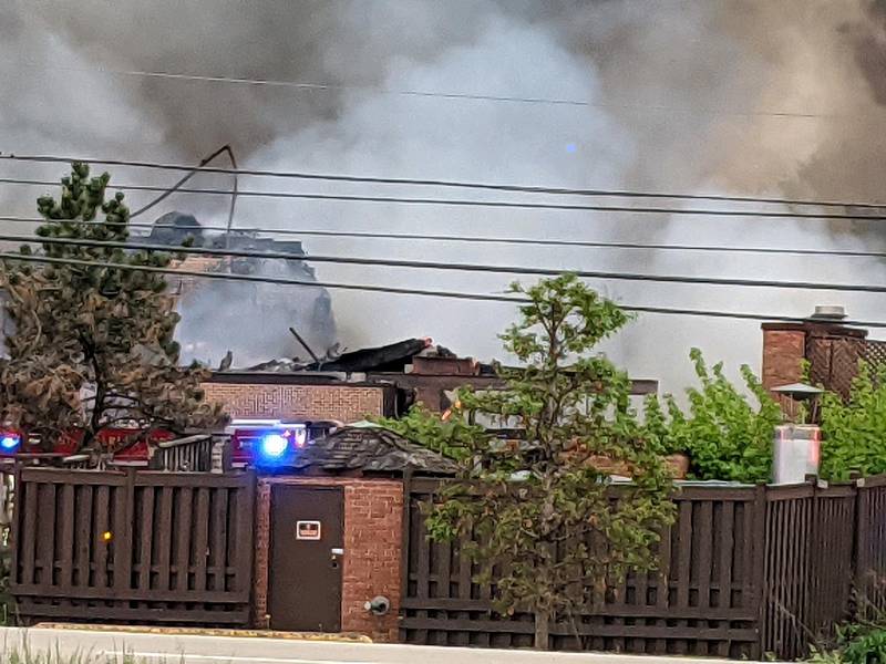 Plumes of smoke hover above the scene of the fire on Saturday at the former Pheasant Run  in St. Charles.