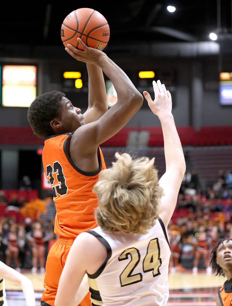 DeKalb's Davon Grant shoots over Sycamore's Lucas Winburn during the First National Challenge Friday, Jan. 27, 2023, at The Convocation Center on the campus of Northern Illinois University in DeKalb.