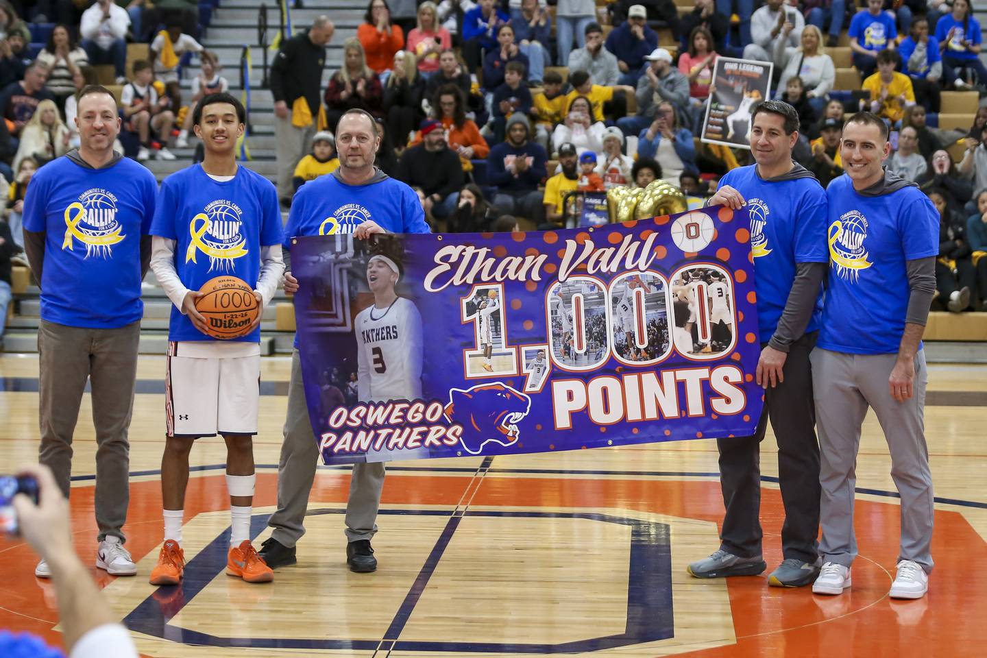 Oswego's Ethan Vahl is honored for scoring 1,000 points as a sophomore at the half during their basketball game between Yorkville at Oswego, Feb 7, 2026 in Oswego.