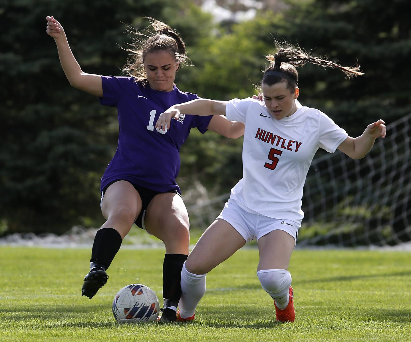 Hampshire's Adriana Hurley knocks Huntley's Maizie Nickle off the ball during a Fox Valley Conference soccer game on Tuesday, April 23, 2024, at Hampshire High School.