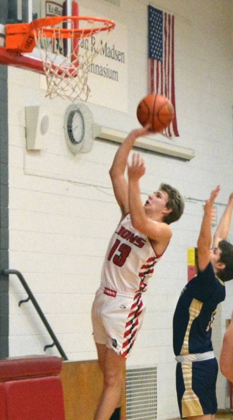 LaMoille's  Josh Martin takes in a second-half layup against Hiawatha Wednesday night at Dean Madsen Gymnasium. He scored 21 points to lead the Lions to a 62-54 victory