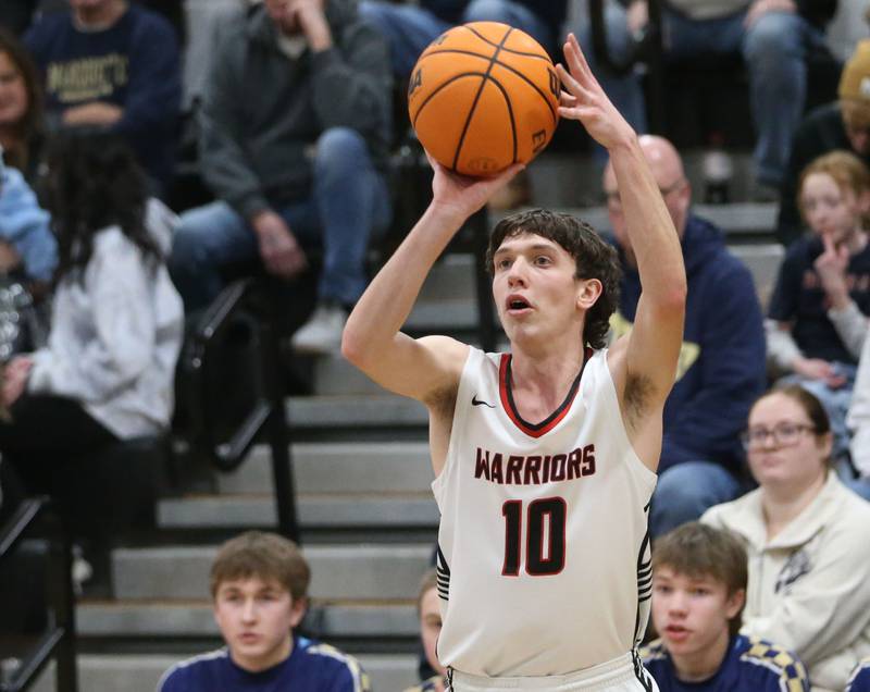Woodland's Jaron Follmer shoots a wide-open jump shot against Marquette during the Tri-County Conference Tournament championship on Friday, Jan. 30, 2026 at Putnam County High School.