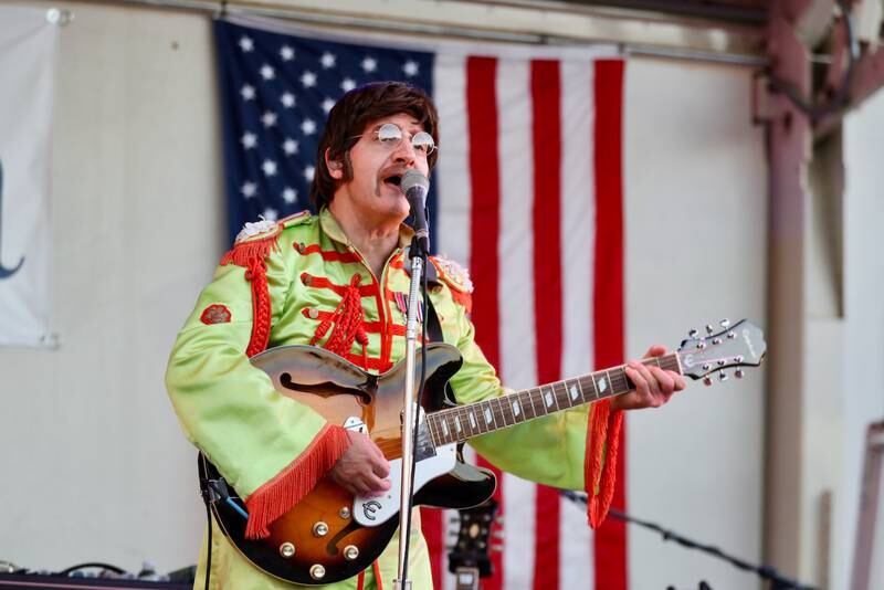 The show featured a variety of costumes modeled after iconic Beatles attire.