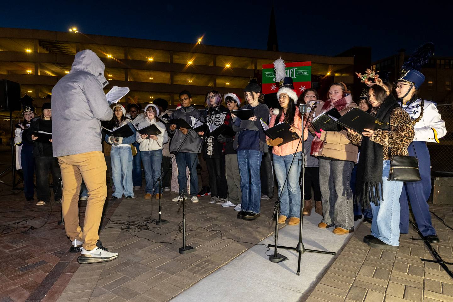 Members of Joliet Central’s choir and band perform during the Light Up the Holidays Tree Lighting Ceremony at Joliet’s City Square on Nov. 28, 2025.